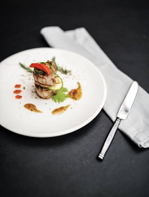 Food styling steak on white plate